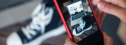 Capturing sneakers with a mobile phone for an online store showcase. E-commerce at its best.